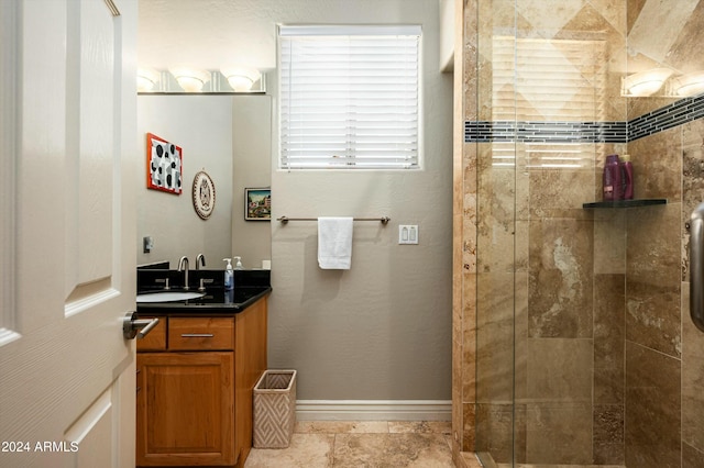 bathroom featuring vanity and tiled shower