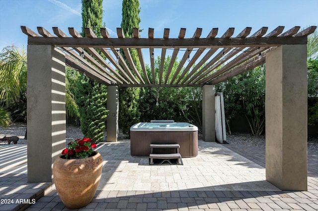 view of patio featuring a pergola and a hot tub