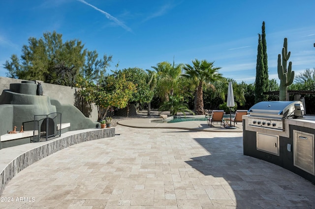 view of patio / terrace featuring exterior kitchen and grilling area