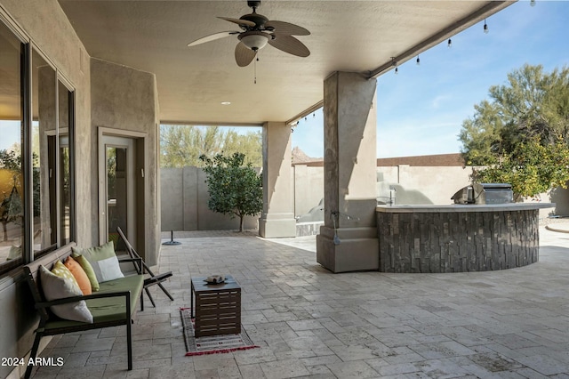 view of patio featuring outdoor lounge area, area for grilling, and ceiling fan