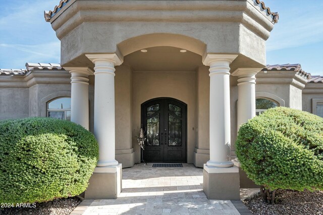 property entrance featuring french doors