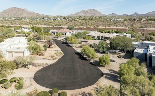 birds eye view of property featuring a mountain view