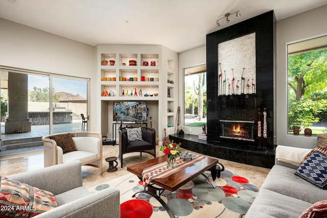 living room featuring a premium fireplace