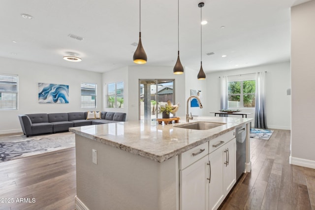 11872 W Duane Ln, Peoria, AZ 85383 - kitchen with a sink, dark wood-type flooring, baseboards, a kitchen island with sink, and dishwasher
