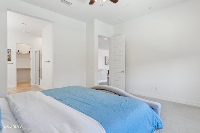 11872 W Duane Ln, Peoria, AZ 85383 - bedroom featuring baseboards, a walk in closet, ceiling fan, and light carpet