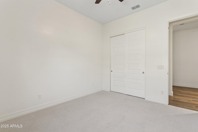 11872 W Duane Ln, Peoria, AZ 85383 - unfurnished bedroom featuring carpet flooring, a closet, baseboards, and a ceiling fan