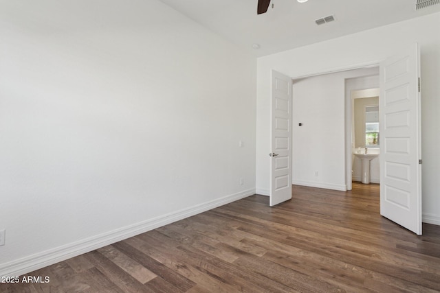 11872 W Duane Ln, Peoria, AZ 85383 - unfurnished bedroom with dark wood-style floors, baseboards, a ceiling fan, and a sink