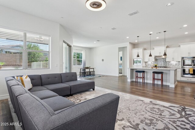 11872 W Duane Ln, Peoria, AZ 85383 - living area with wood finished floors, recessed lighting, and baseboards
