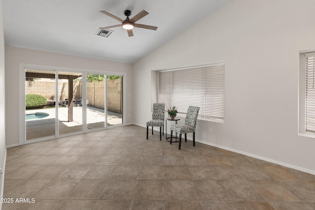 sitting room with a ceiling fan, baseboards, visible vents, and high vaulted ceiling