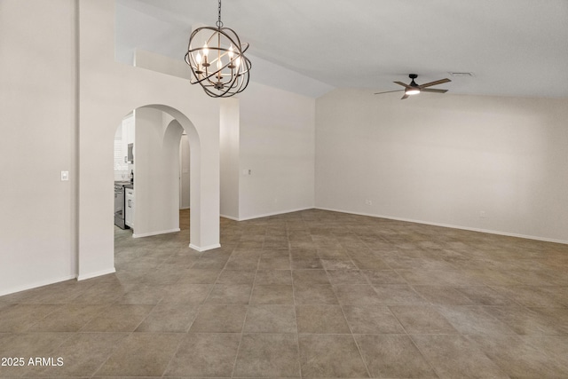 unfurnished room featuring baseboards, arched walkways, ceiling fan with notable chandelier, and vaulted ceiling