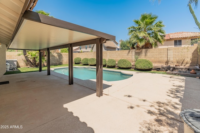 view of swimming pool featuring a fenced in pool, a fenced backyard, and a patio area