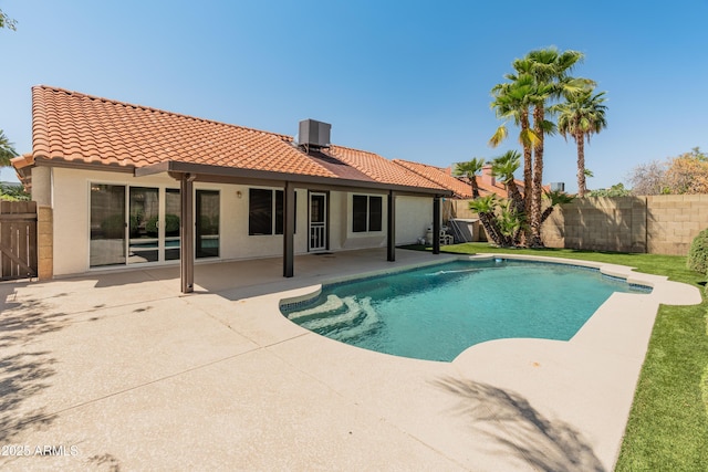 view of swimming pool with a patio, fence, central air condition unit, and a fenced in pool