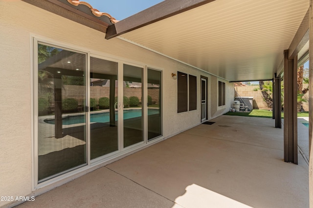 view of patio / terrace featuring fence