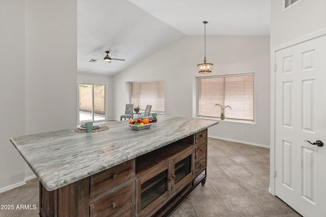 kitchen featuring ceiling fan, decorative light fixtures, visible vents, vaulted ceiling, and light tile patterned flooring