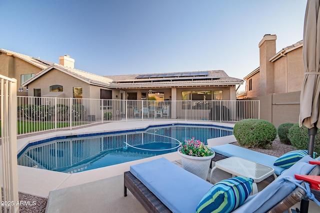view of pool featuring a patio area, a fenced in pool, and fence