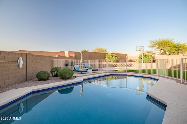 view of pool with fence, a fenced in pool, and a patio