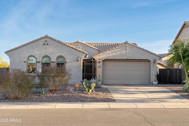 mediterranean / spanish-style house featuring a garage