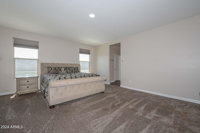 carpeted bedroom with baseboards