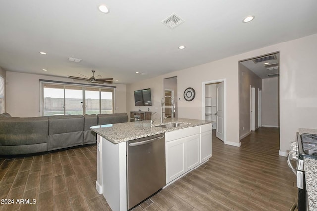 kitchen featuring visible vents, a sink, appliances with stainless steel finishes, white cabinetry, and open floor plan