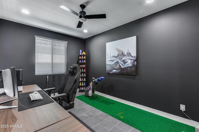 office space with ceiling fan and a textured ceiling