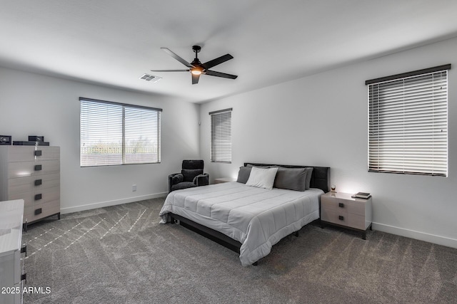 bedroom featuring ceiling fan and dark carpet