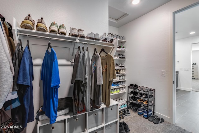 spacious closet featuring carpet floors