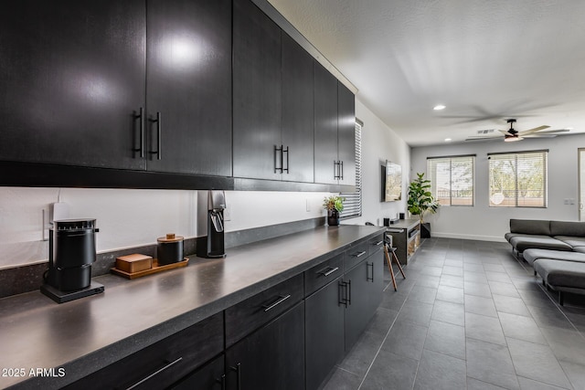 kitchen with tile patterned floors and ceiling fan