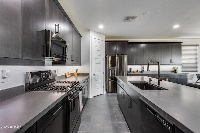 kitchen featuring sink, dark brown cabinets, and black appliances