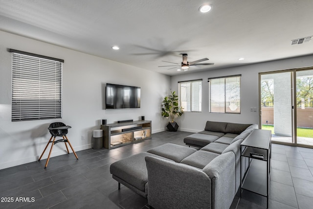 living room featuring ceiling fan