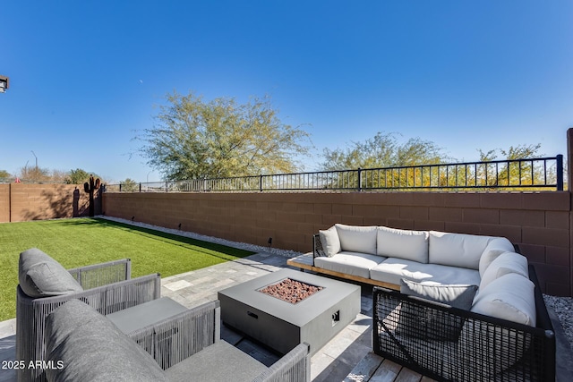 view of patio featuring an outdoor living space with a fire pit