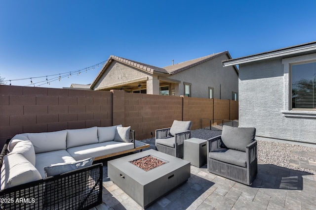 view of patio / terrace featuring an outdoor living space with a fire pit