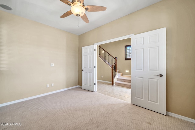 carpeted empty room with ceiling fan