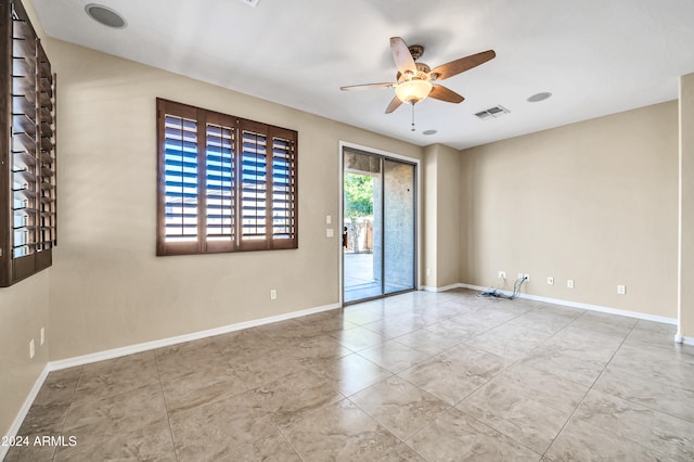 unfurnished room with ceiling fan