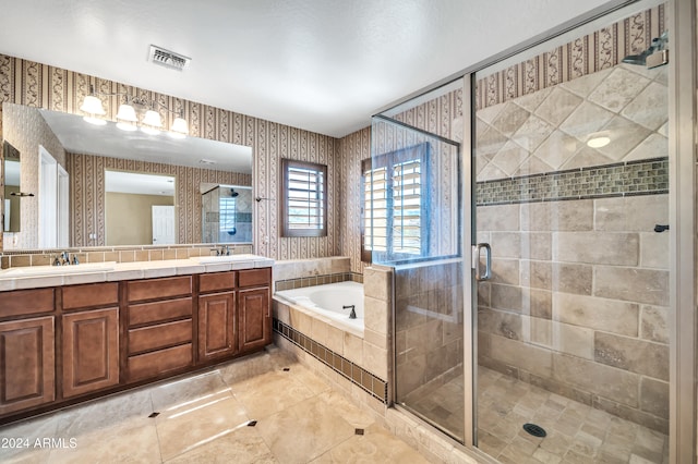 bathroom featuring vanity and plus walk in shower