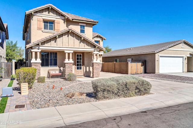 craftsman inspired home with a garage and a porch