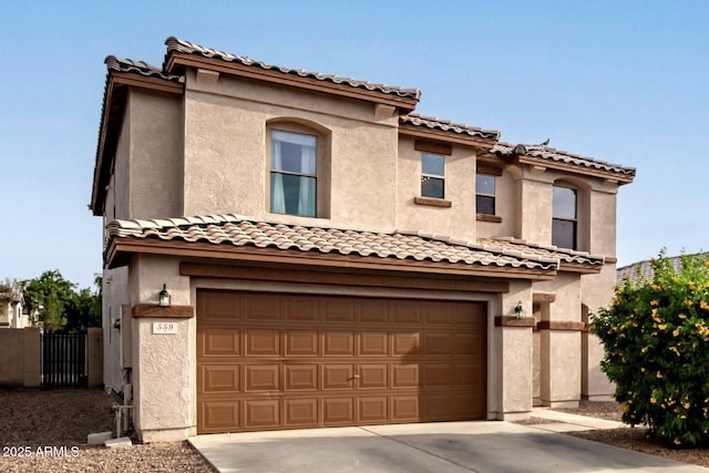559 W Viola St, Casa Grande, AZ 85122 - mediterranean / spanish-style home featuring stucco siding, an attached garage, fence, and driveway