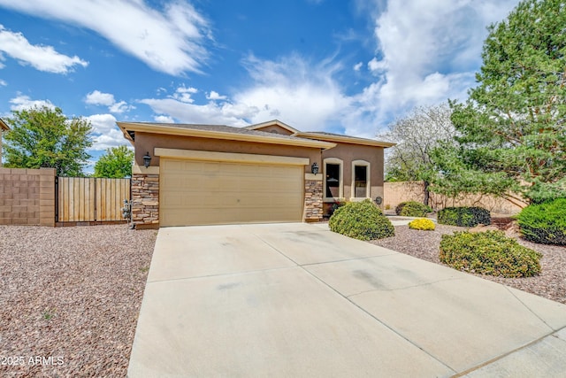 view of front facade featuring a garage, stucco siding, stone siding, and fence