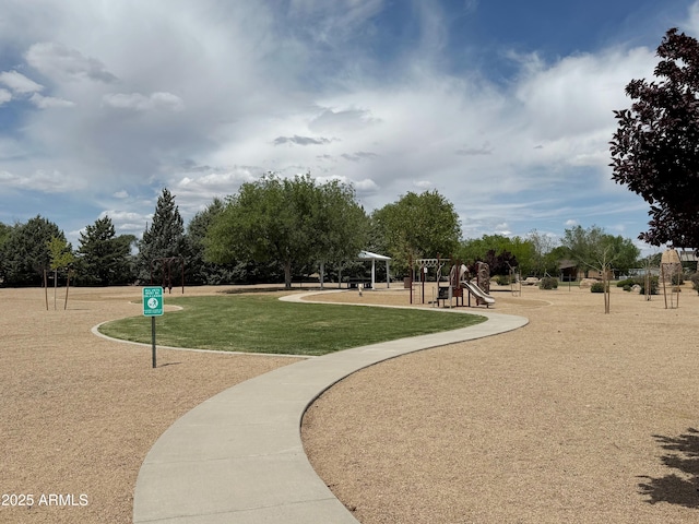 surrounding community with a lawn and playground community