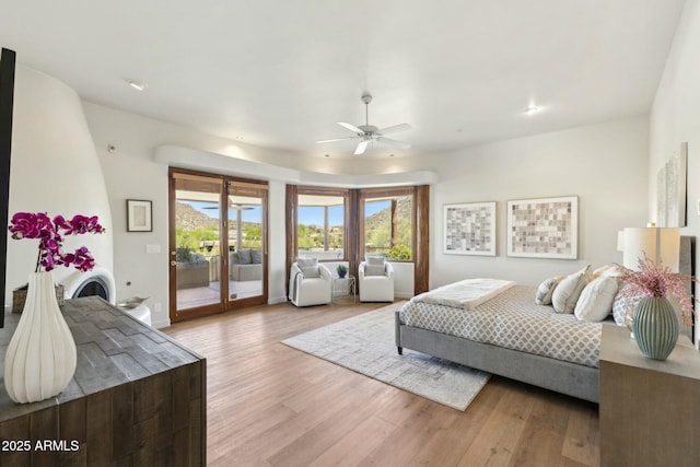 11334 E Troon Vista Dr, Scottsdale, AZ 85255 - bedroom featuring a ceiling fan, access to exterior, and light wood-type flooring