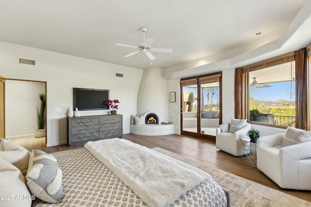 11334 E Troon Vista Dr, Scottsdale, AZ 85255 - bedroom featuring wood finished floors, visible vents, ceiling fan, and access to exterior