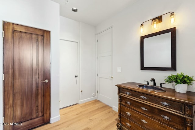 11334 E Troon Vista Dr, Scottsdale, AZ 85255 - bathroom featuring wood finished floors, vanity, and baseboards