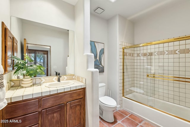 11334 E Troon Vista Dr, Scottsdale, AZ 85255 - full bath featuring vanity, toilet, tile patterned flooring, and bath / shower combo with glass door