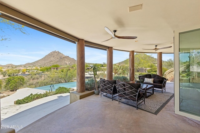 11334 E Troon Vista Dr, Scottsdale, AZ 85255 - view of patio featuring a mountain view, visible vents, ceiling fan, and outdoor lounge area