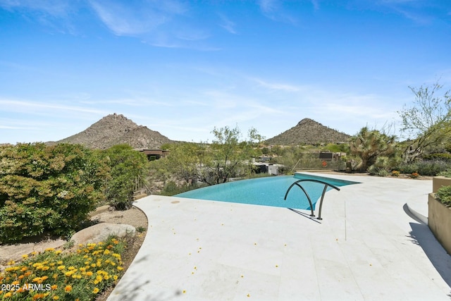 11334 E Troon Vista Dr, Scottsdale, AZ 85255 - view of pool featuring an infinity pool, a mountain view, and a patio
