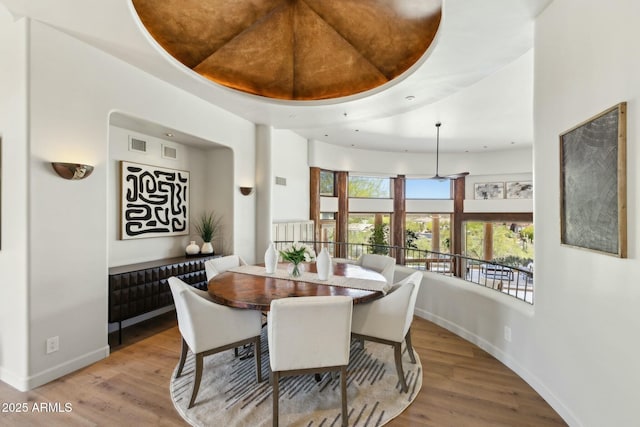 11334 E Troon Vista Dr, Scottsdale, AZ 85255 - dining room with visible vents, baseboards, and wood finished floors