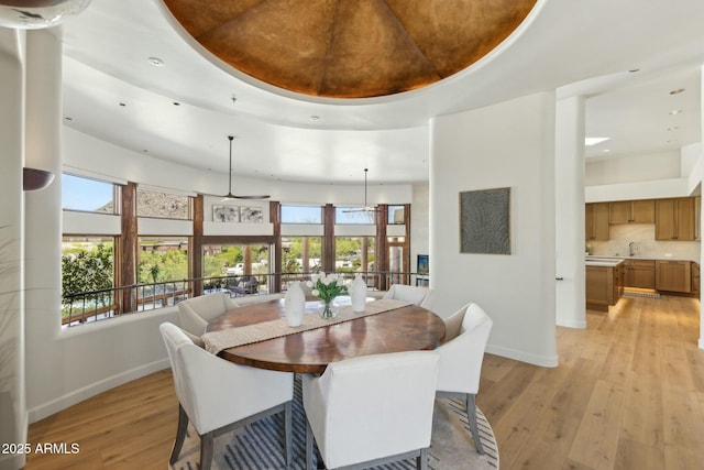 11334 E Troon Vista Dr, Scottsdale, AZ 85255 - dining space featuring recessed lighting, baseboards, a tray ceiling, and light wood-type flooring