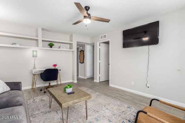 15610 N 29th St Unit 3, Phoenix, AZ 85032 - living area featuring wood finished floors, ceiling fan, and a desk
