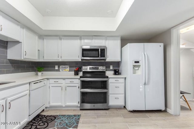 15610 N 29th St Unit 3, Phoenix, AZ 85032 - kitchen featuring stainless steel appliances, light countertops, and white cabinets