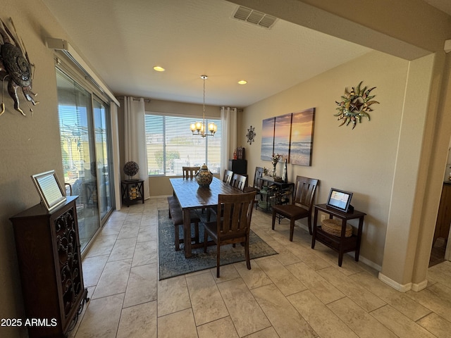 dining area featuring a chandelier