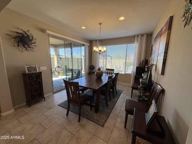 dining area featuring a notable chandelier and plenty of natural light